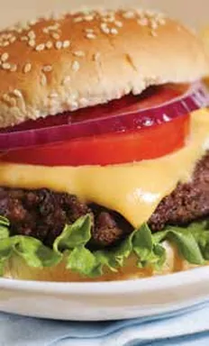 A large cheeseburger on a plate