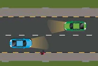 Night road: two cars approaching each other, one on dipped beam; a pedestrian on the right verge
