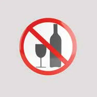 Red prohibition circle over a wine bottle and glass