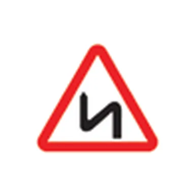 UAE road sign: Double bend, first to the left
